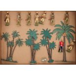 A set of hand painted Indian Frontier Force figures:, together with four palm trees.