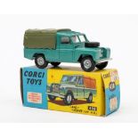 A Corgi 438 Land Rover 109:, metallic green with lemon interior, grey tilt and cast hubs,