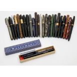 A collection of Waterman's fountain pens:, including a red marble 'Unique-Junior', a '512M',
