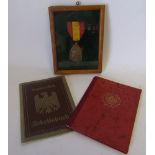 Two German WWII labour movement document books: and Belgium Commemorative War Medal.