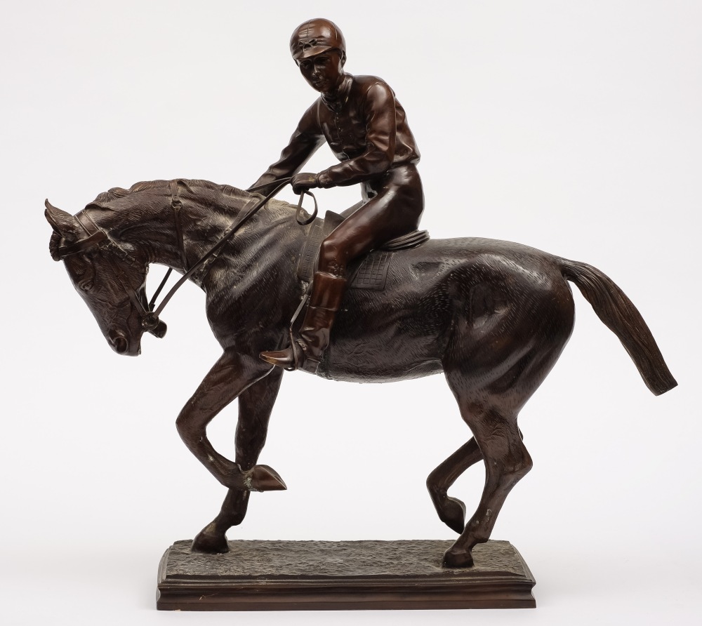 A bronze figure of racehorse with jockey up:, unsigned, on a rectangular base, 54cm high.