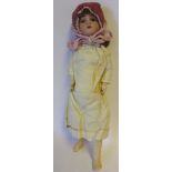 A late 19th century Continental bisque head doll: impressed 3/0, with brown mohair wig,