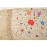 A Victorian cream silk and floral embroidered shawl:, with tassel fringe,