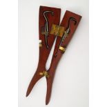 An early 20th century novelty wooden lady's leg folding boot pull:,