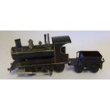 An 0 gauge 0-4-0 live steam loco: with non matching tender, possibly by Bing.
