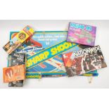 A collection of various board games and annuals: including 'Sharp Shooter', 'Formula 1',