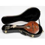 An eight string mandolin by Colin Kendall:, in a fitted case, 65cm long..