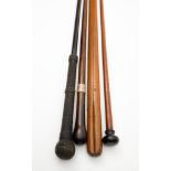 An ebony and ropework walking cane, an Edwardian silver mounted rosewood walking cane,