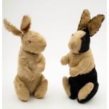 An early 20th century white plush Albino rabbit and a similar black and white plush rabbit:,