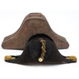 A Royal Navy bicorn hat in Russian lacquer tin:, with gilt braid and button.