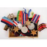 Nine various WWII General Service Medals together with a collection of ribbons,