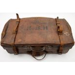 A brown leather travelling suitcase by The Army & Navy Co-operative, London:,