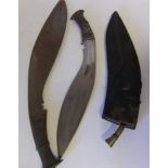 A Malayan Kukri of traditional design: in leather scabbard, together with another kukri, (2).