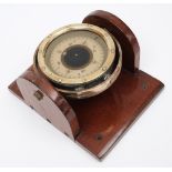 A 4 inch liquid filled compass:, no 8256K, in brass gimbaled mount on later wooden plinth.