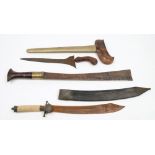 A Malayan Kris together with two Burmese style short swords:,