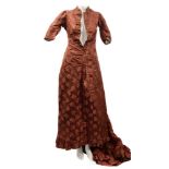 A late 19th/early 20th century floral embroidered silk dress:, with short mandarin collar,