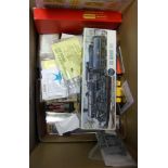A collection of assorted model railway accessories: including decals, kits, wheels,