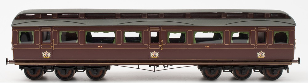 A good scratch built dining carriage in LMS livery:,gold coach lines on maroon body,