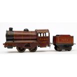 A Wells-Brimtoy No335 clockwork tinplate 0-4-0 locomotive and tender '7040':,