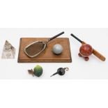 A group of five early 20th century novelty inkwells:, comprising a cricket bat and ball,