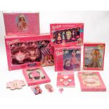 A Barbie teaset, a talking alarm clock and a collection of Barbie related toys and accessories:.