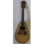 An Italian rosewood and tortoiseshell inlaid mandolin: with mother of pearl strung border,