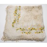 An early 20th century silk and lace embroidered bedspread:,