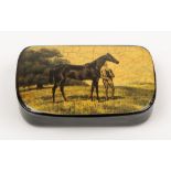 An early 20th century papier mache snuff box with lithograph decorated lid of a stallion and groom:,