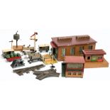A wooden double tack engine shed, a wooden platform with waiting room and ticket office,