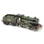 Hornby, an 0-4-0 clockwork locomotive No 1179 and four wheel tender: in Southern green livery.