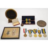 Two WWI memorial plaques:, one with a trio of medals to '3793 Pte K R Graham 16 Lond R',