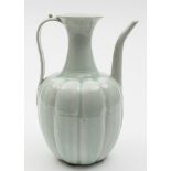 A Chinese Qingbai porcelain wine ewer: of melon shaped form with raised flaring neck,