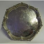 A Victorian silver salver, maker James Johnson & John Walker, London, 1875: monogrammed,