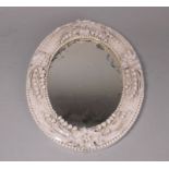 A Belleek porcelain oval Lily of the Valley mirror: first black mark, 27 cm high.