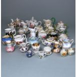 A mixed group of miniature porcelain jugs, bowls,