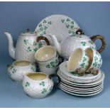 A Belleek Shamrock pattern part tea service: comprising teapot and cover, hot water jug and cover,
