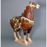 A Chinese sancai glazed pottery figure of a Fereghan horse: in Tang-style,