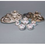 Two Crown Staffordshire miniature porcelain cabaret sets: each comprising a tray, teapot and cover,