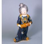 A Chinese sancai glazed pottery figure: in Tang-style, 36 cm high.