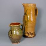Clive Bowen (born 1943) two terracotta jugs: one of ribbed and bellied 'Medieval' form with incised