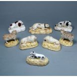 Eight Samuel Alcock porcelain dogs: comprising a mastiff, a pair of spaniels, two matching,