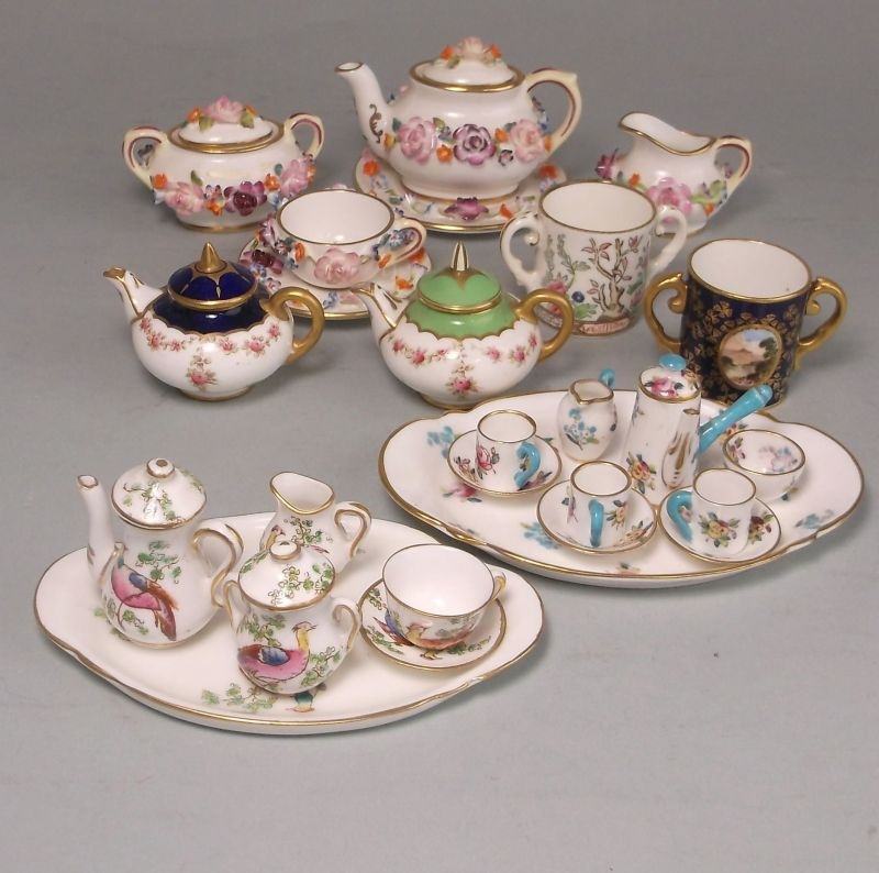 A group of Coalport porcelain miniature wares and two Crown Staffordshire services: comprising a