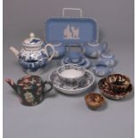 A mixed group of toy and miniature pottery items: comprising two Wheildon tea bowls and a saucer,