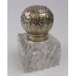 A continental silver mounted clear glass inkwell: monogrammed, of square outline,