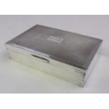 An Elizabeth II silver cigarette box, maker Garrard & Co Ltd,
