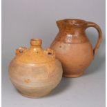 A Verwood pottery 'owl' costrel and jug: the former of typical globular form with raised ribbed lug