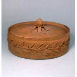 A cane ware pie dish and cover: of oval form the exterior of the dish moulded with an encircling