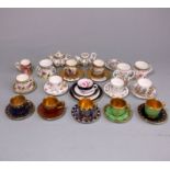 A group of miniature Coalport porcelain: comprising ten cups, twelve saucers,