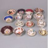 Seven English porcelain miniature jug and basin sets and one other: decorated variously comprising