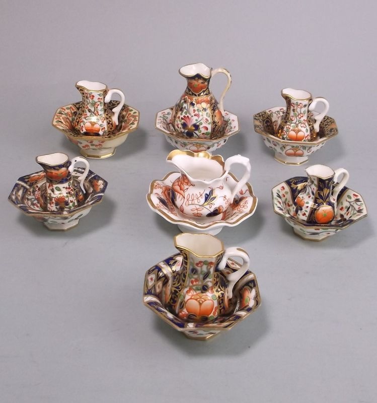 Seven Derby porcelain toy jug and basin sets: each decorated variously in the Witches and Imari